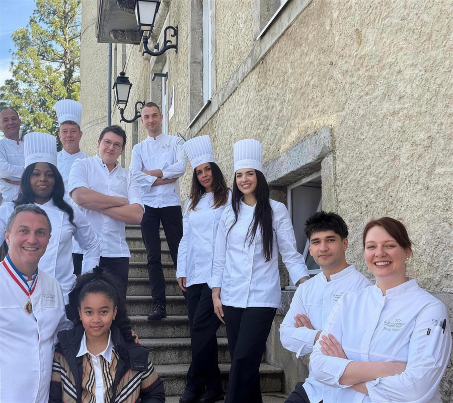 Nanette with her pastry class on the school steps in France